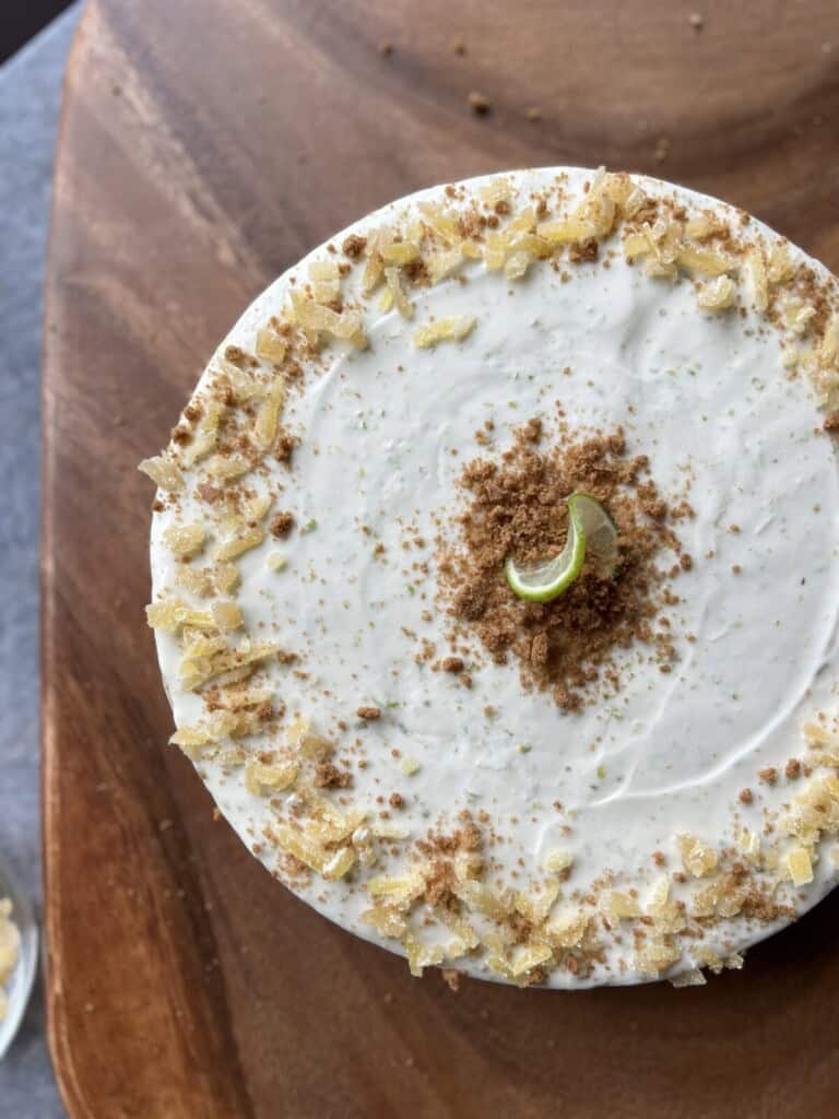 key lime cheesecake on a wooden serving board.