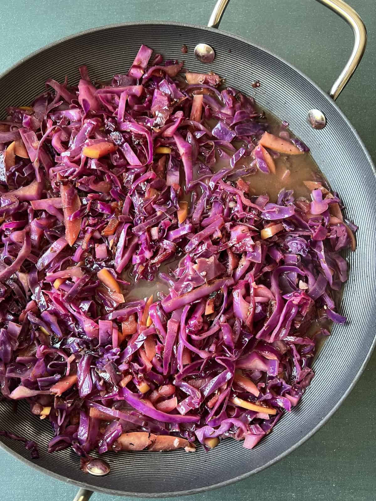 the cabbage mixture is stirred together and liquid ingredients are added.