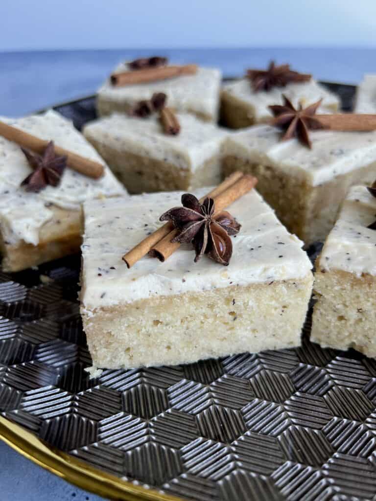 slices of spiced chai cake are arranged on a platter