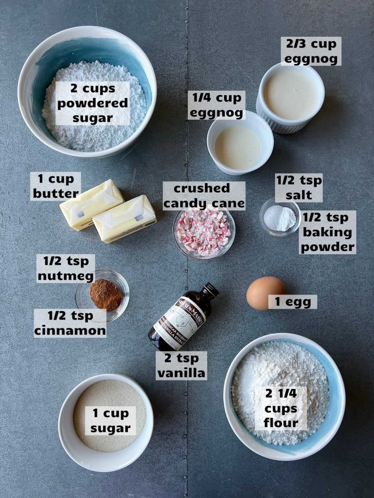 all of the ingredients needed to make eggnog cookie bars are laid out on a work surface and labeled