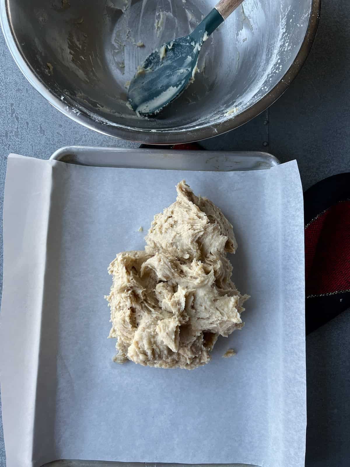 the cookie dough is transferred to the center of a baking sheet