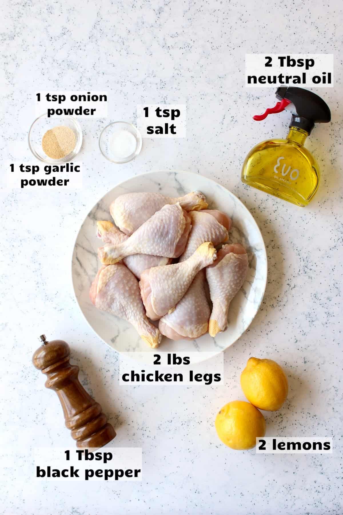 all of the ingredients needed to make lemon pepper chicken legs are laid out on a work surface and labeled