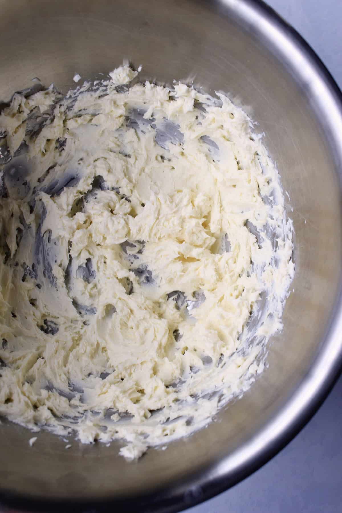 the butter and cream cheese are whipped until light and fluffy