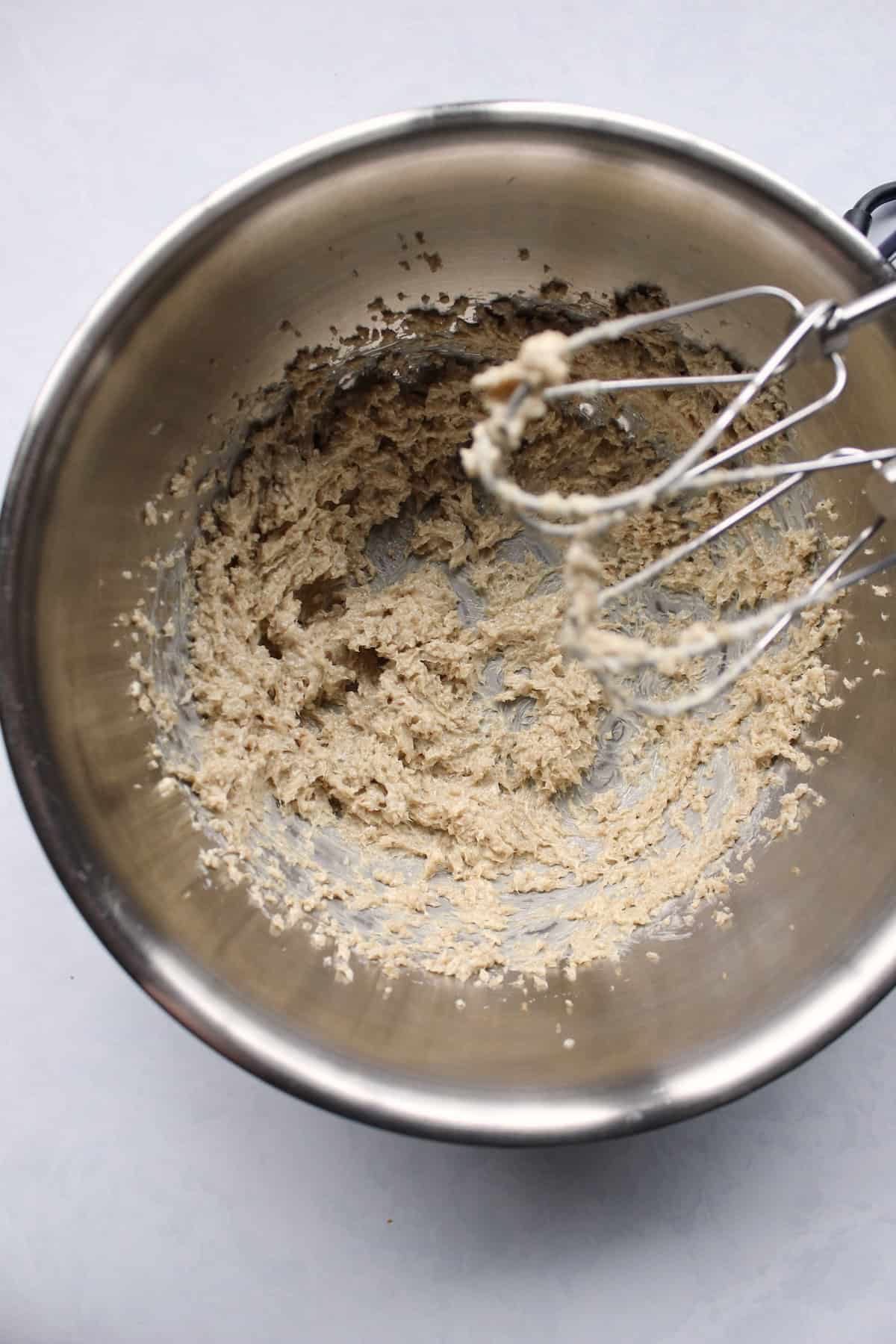 butter and brown sugar are beaten into a fluffy paste