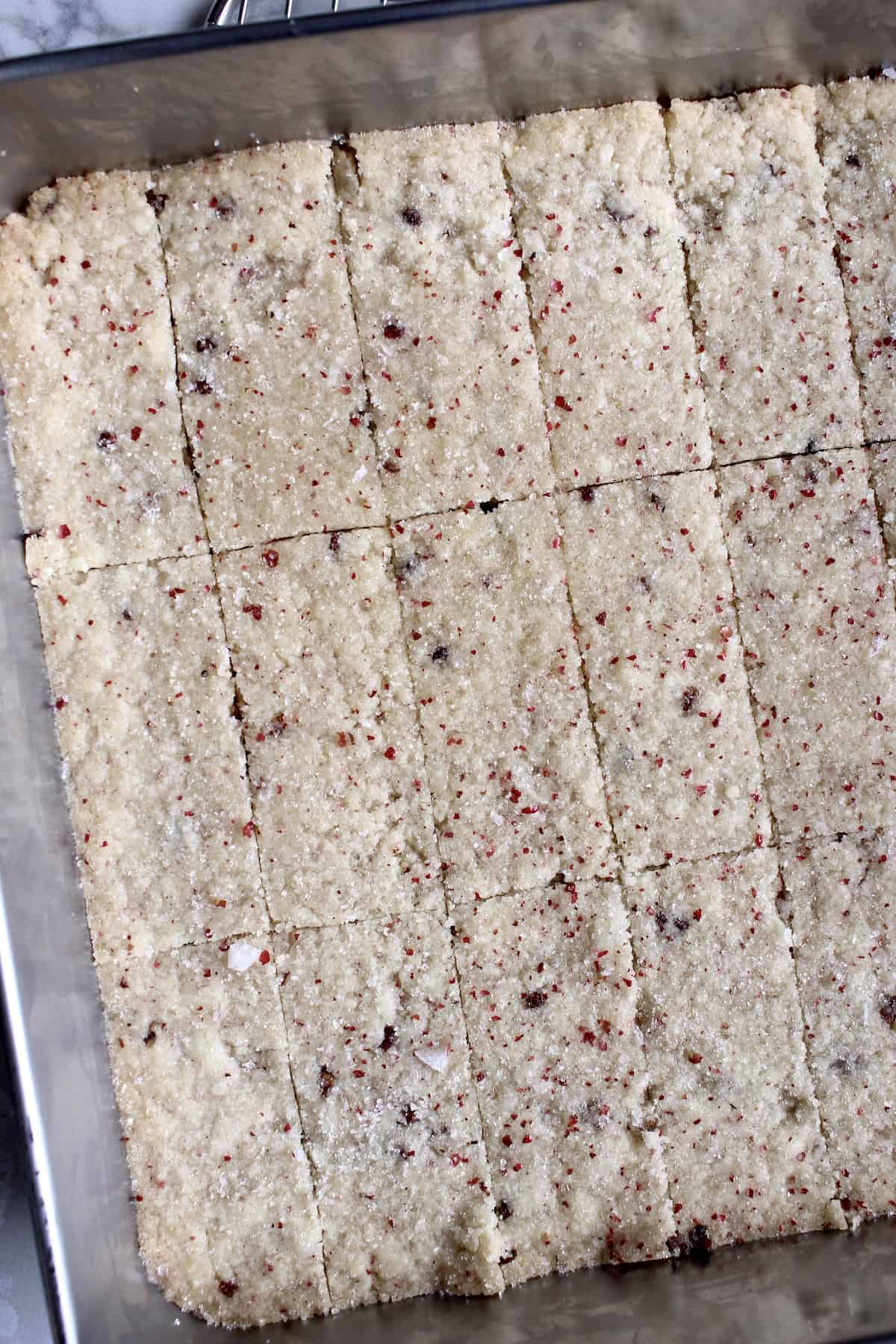 the tray of cookies is sliced into a 7x3 grid, creating 21 bar shaped cookies