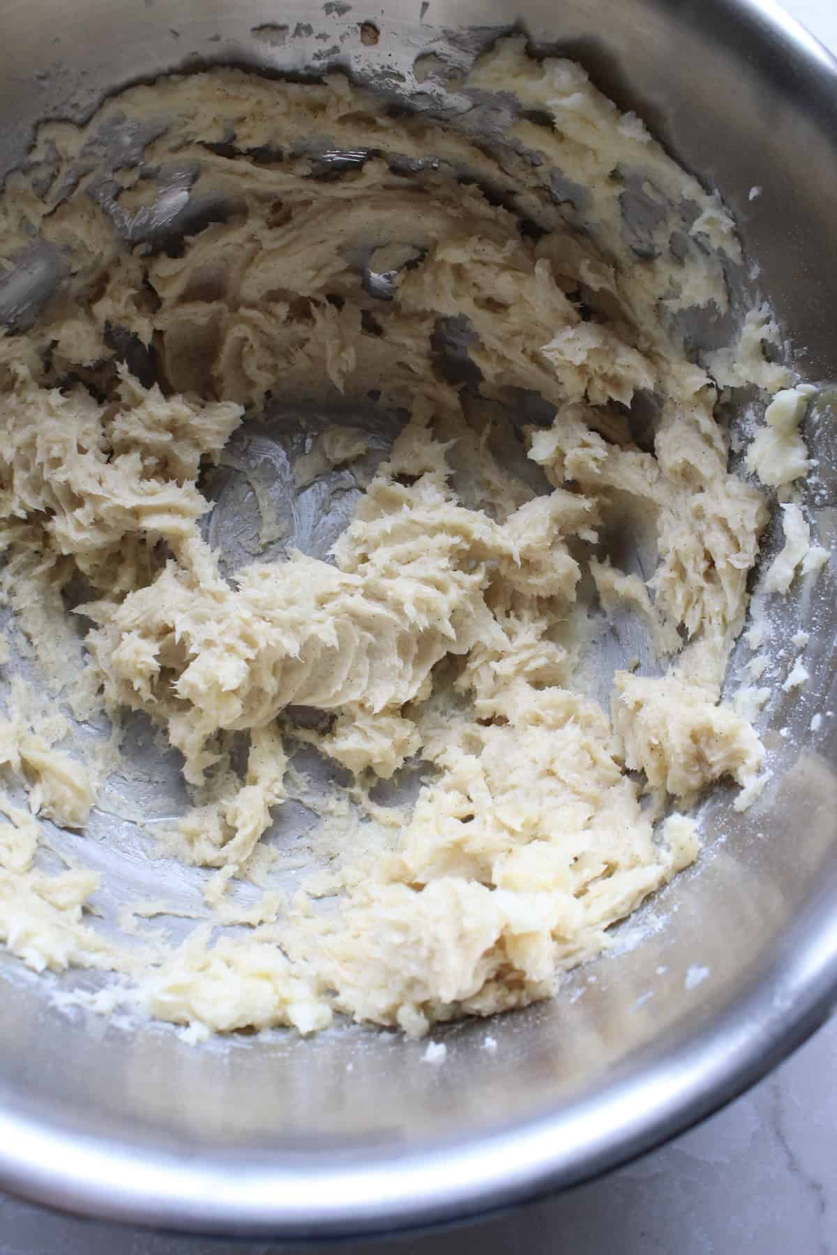 vanilla paste is whipped into the butter mixture, streaking the dough with flecks of vanilla bean
