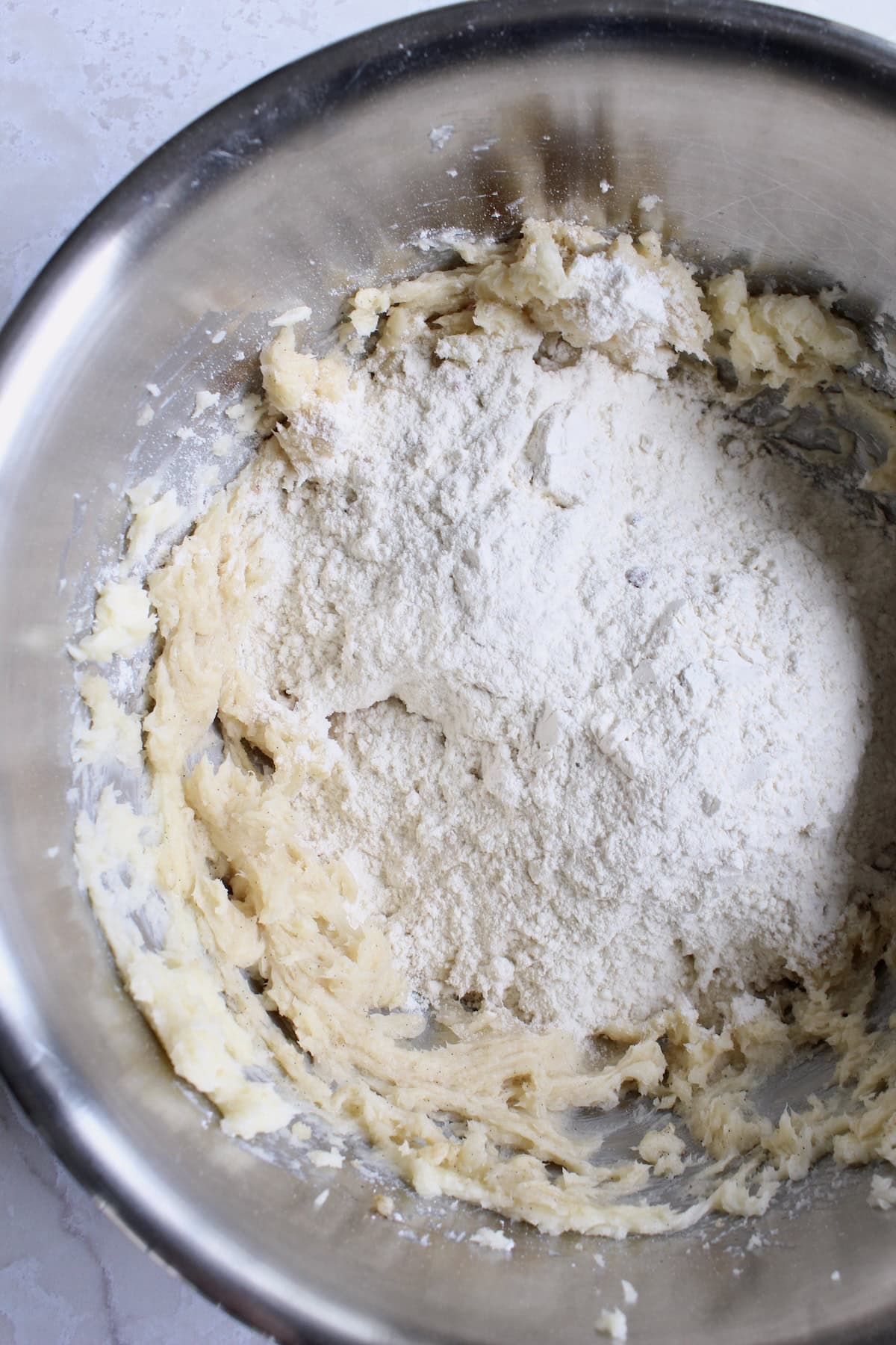the dry ingredient mixture is added to the large bowl with the butter mixture