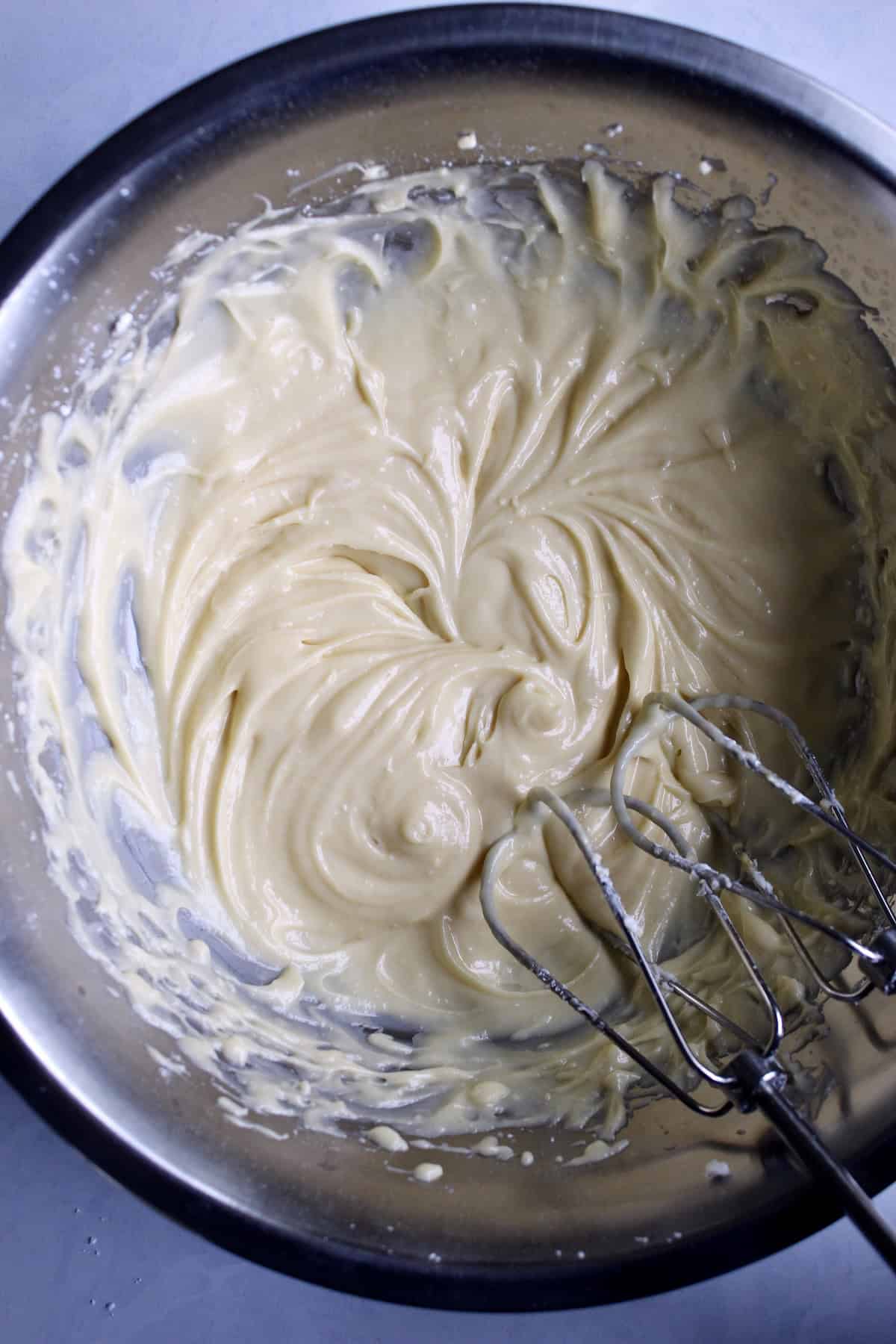 the finishing cream cheese filling has a very shiny, silky appearance.