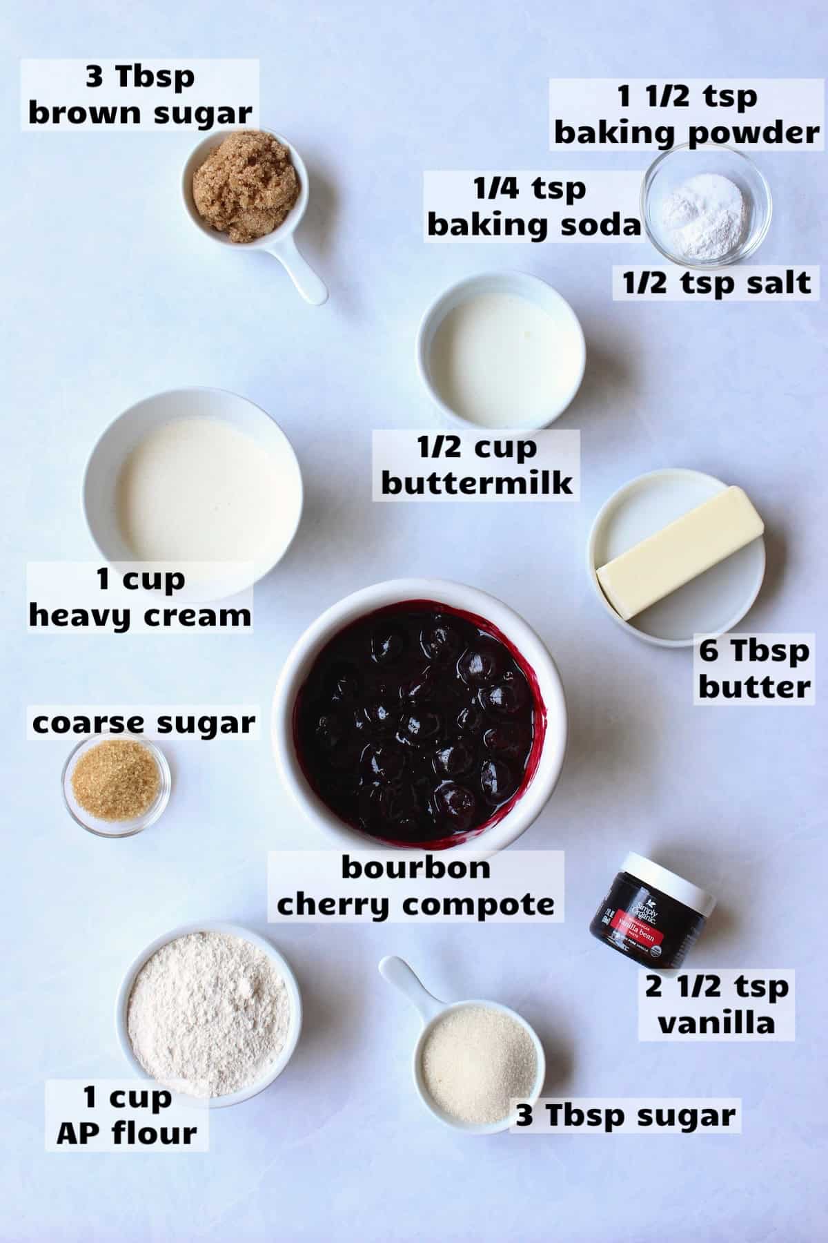 all of the ingredients needed to make bourbon cherry shortcake are laid out on a work surface and labeled