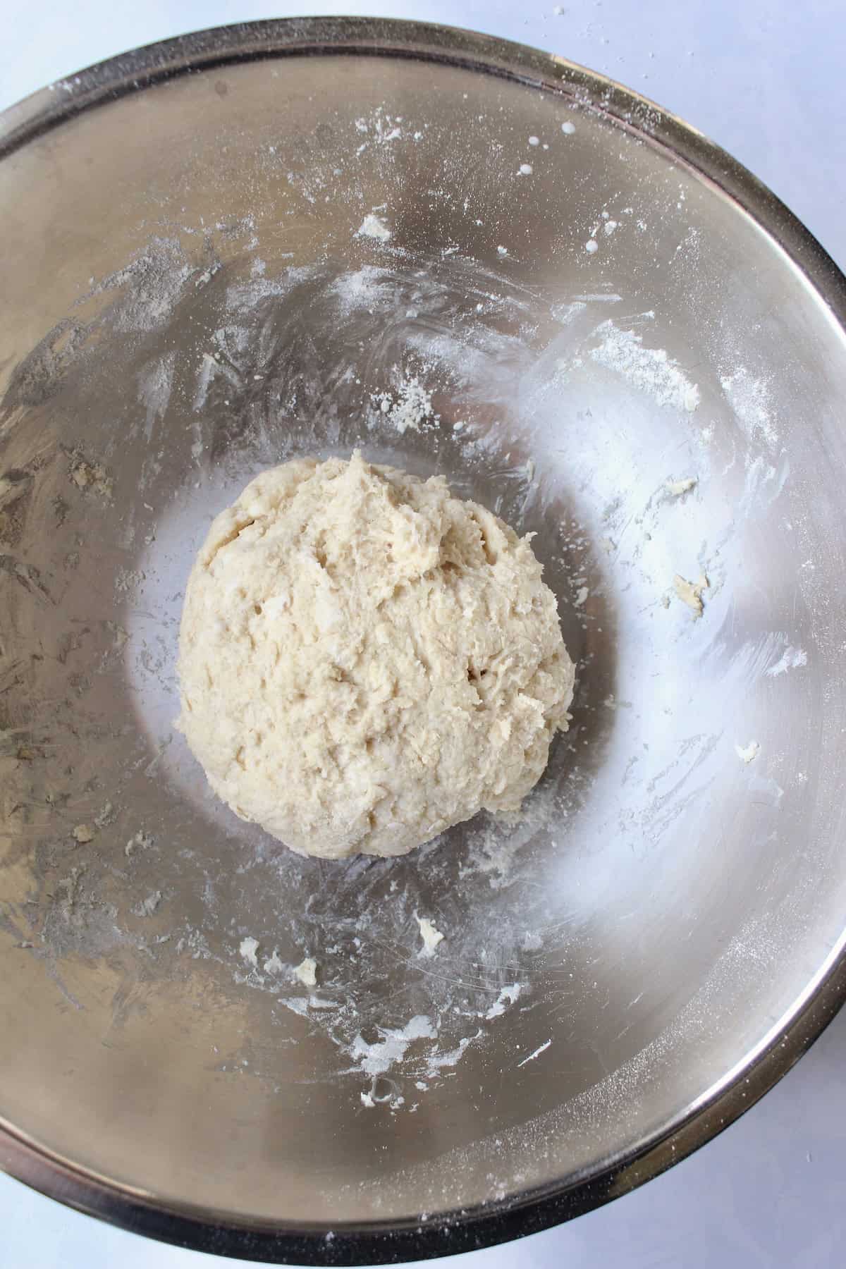 the shortcake dough is fully combined and formed into a shaggy ball