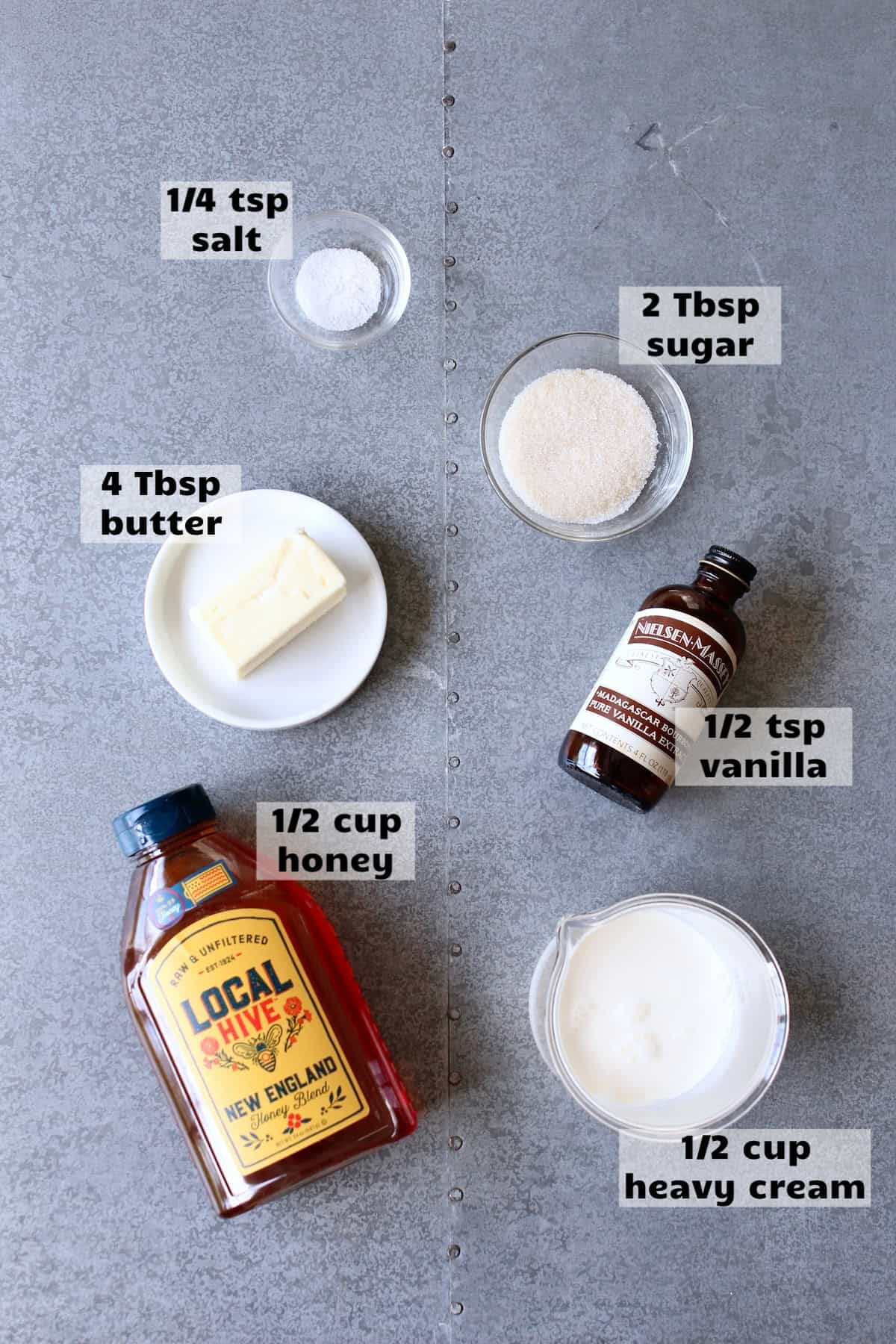 all of the ingredients needed to make honey caramel sauce are laid out on a work surface and labeled