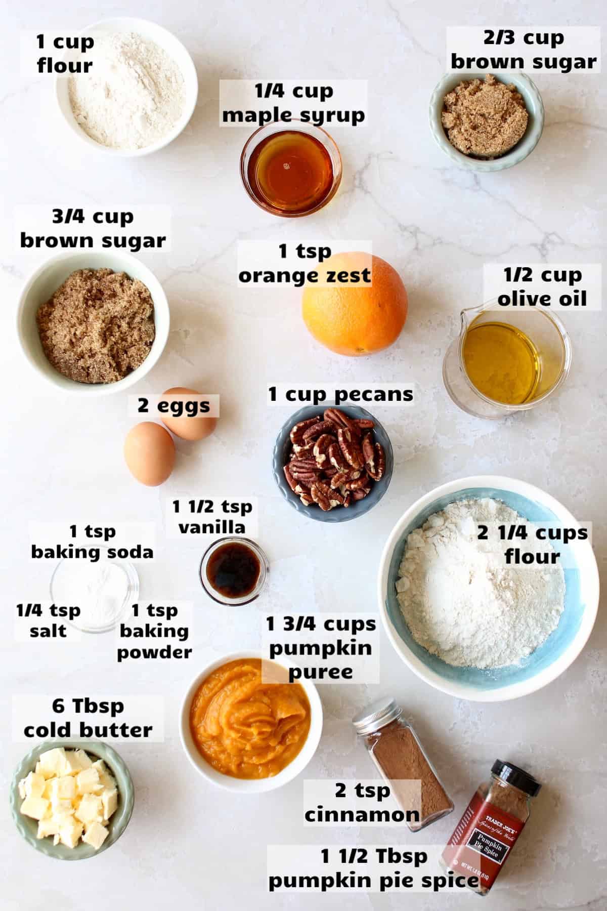 all of the ingredients needed to make pumpkin muffins with pecan streusel are laid out on a work surface and labeled