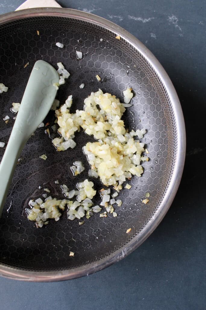 finely chopped onion is caramelized in a small skillet.